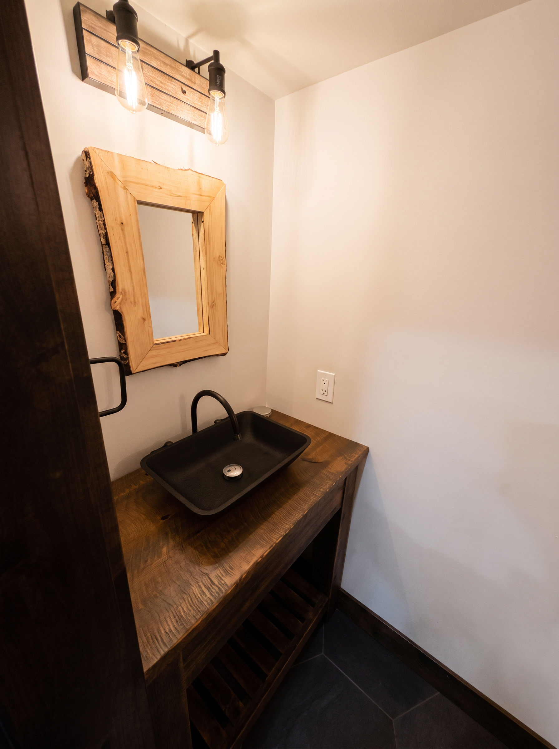 The powder room vanity, cleared and simple