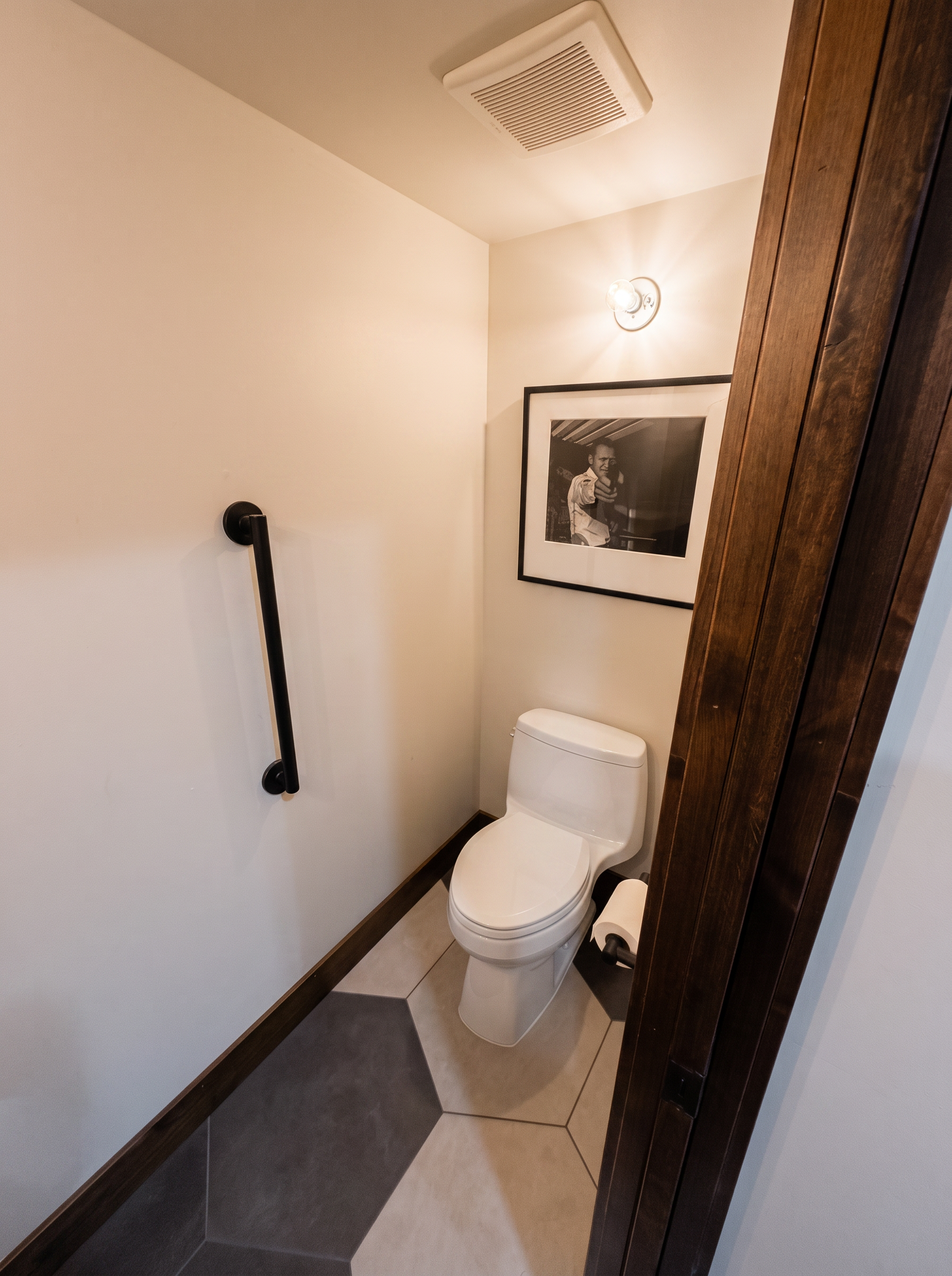 A tiled water closet in soft daylight